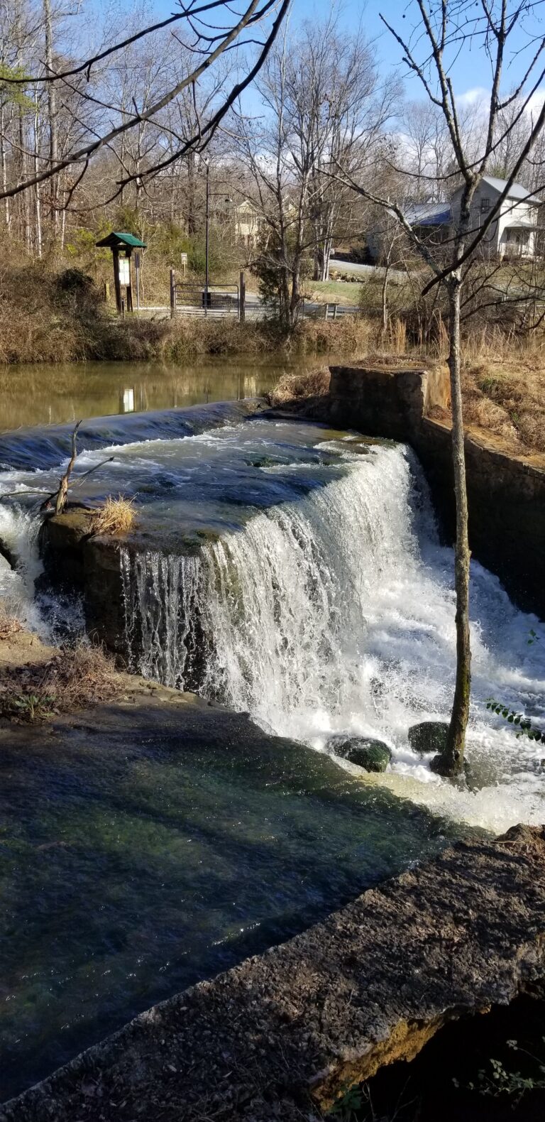 Water pouring over the old dam at Great Bend Park