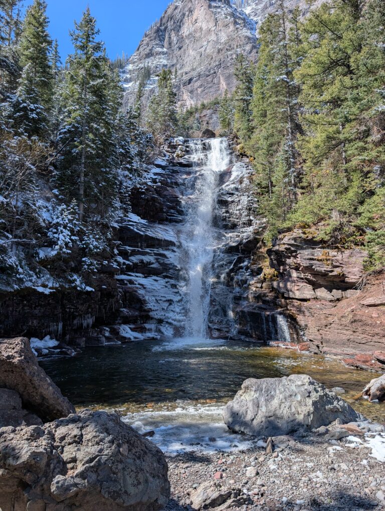 Waterfall into a clear pool along the Bridal Veil Trail